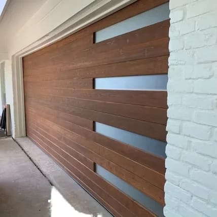 Timber feature slat door with a glazed reveal against white brick